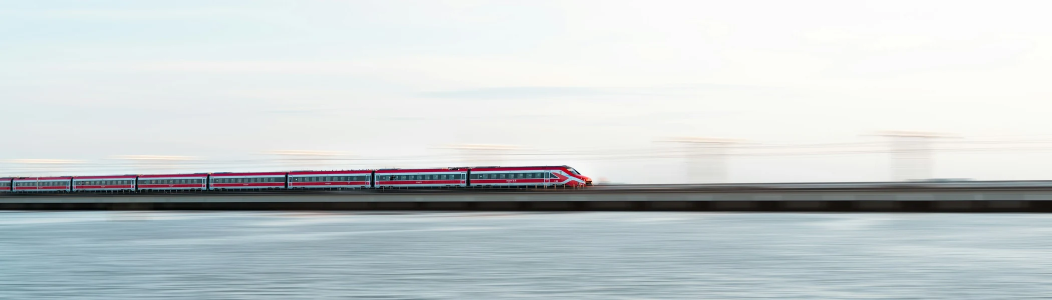 Frecciarossa ETR 700 high-speed train crossing the causeway over the Venetian Lagoon near Venice