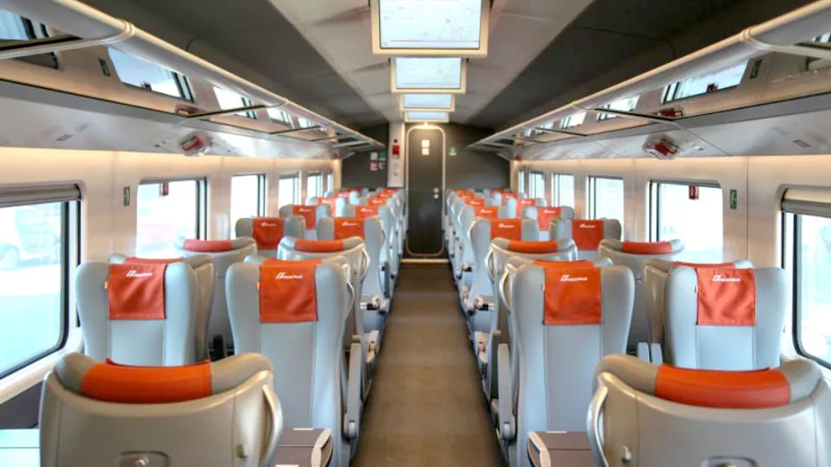 Frecciarossa Standard class interior with 2+2 seating and orange headrest covers